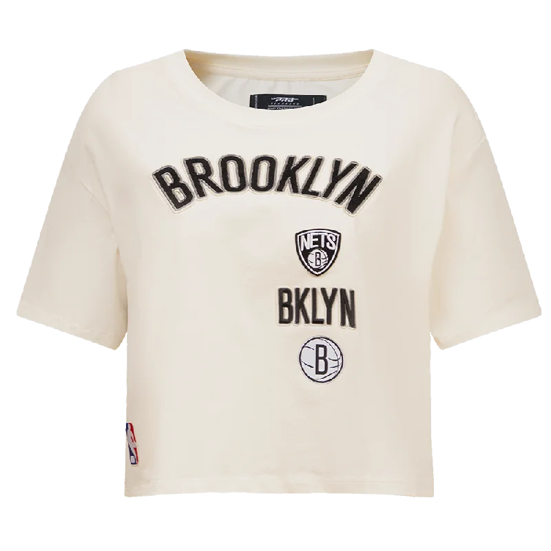 NBA BROOKLYN NETS RETRO CLASSIC WOMEN'S BOXY TEE (EGGSHELL) Mesh Fabric Canvas Fabric Denim Fabric NBA BROOKLYN NETS RETRO CLASSIC WOMEN'S BOXY TEE (EGGSHELL) Mesh Fabric Canvas Fabric Denim Fabric